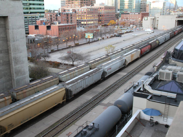 The Canadian Pacific Railway has about 14,000 miles of track in Canada and the U.S. and is headquartered in Calgary, Alberta. While potash, grain and oil shipments have kept tracks busy in Calgary, such as this downtown scene earlier in October, other areas in Canada and the U.S. are still waiting for cars. (DTN photo by Elaine Shein)